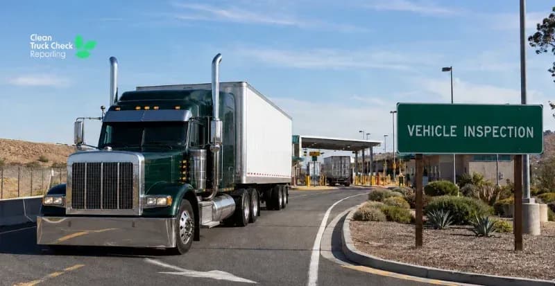 Out-of-state truck at California inspection station for Clean Truck Check compliance.