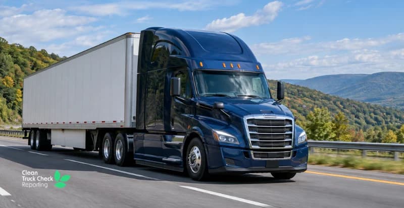 Blue semi-truck hauling a white trailer along a highway, with a Clean Truck Check Reporting logo in the corner.